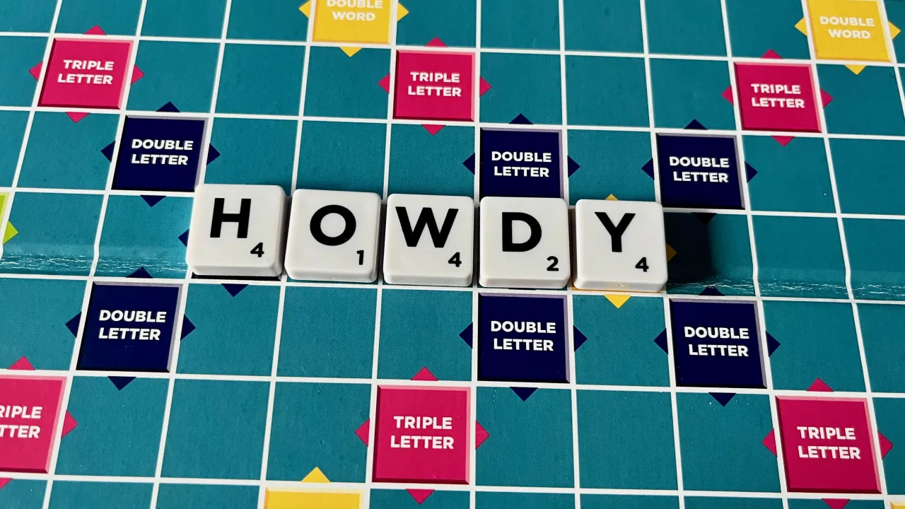 The word HOWDY played on a Scrabble board