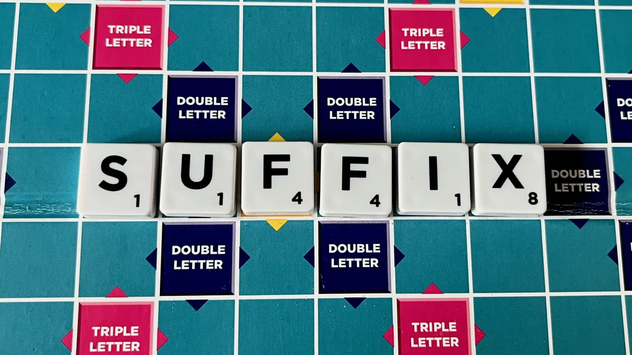 The word suffix on a Scrabble board