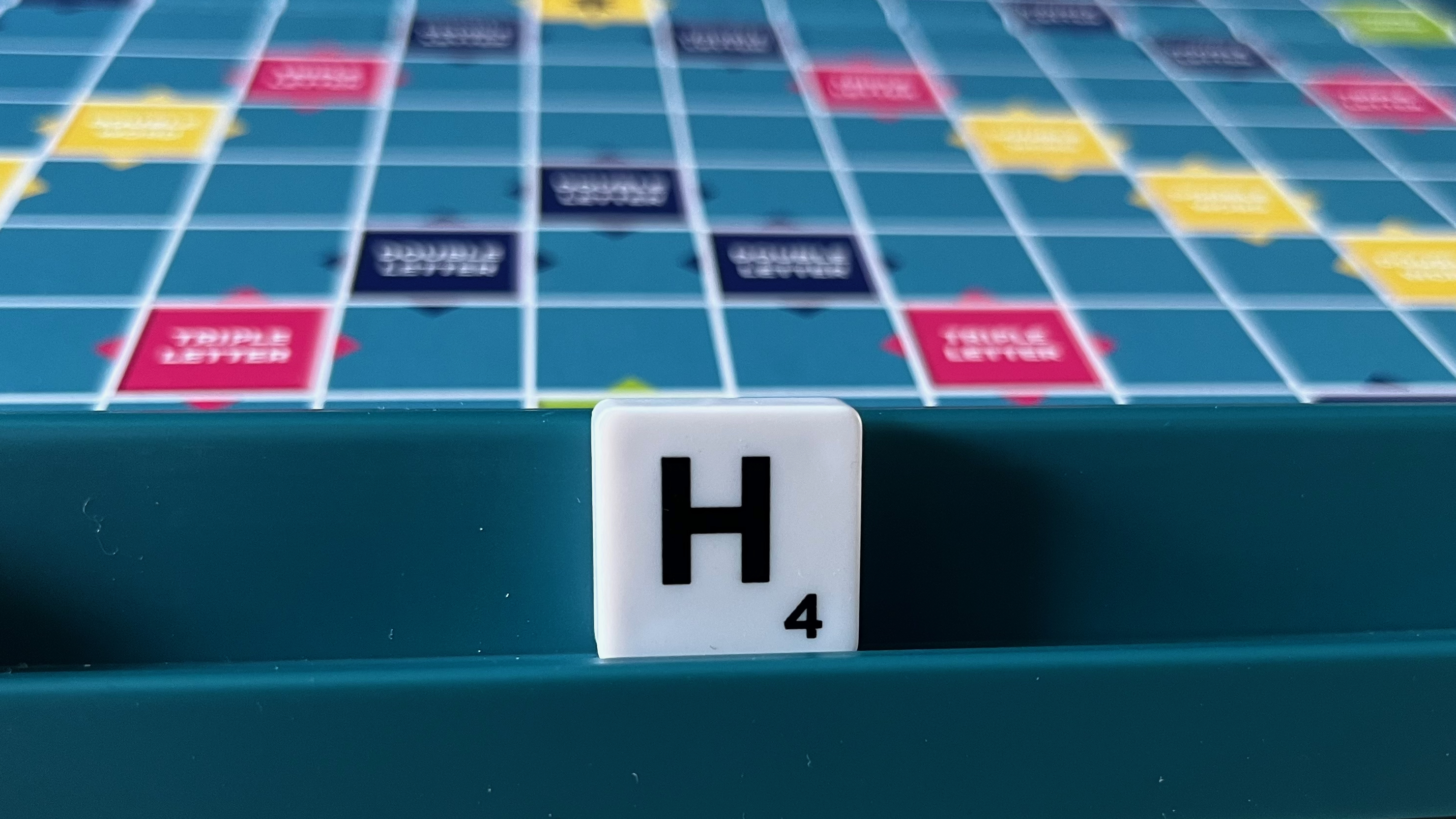The letter H tile in Scrabble