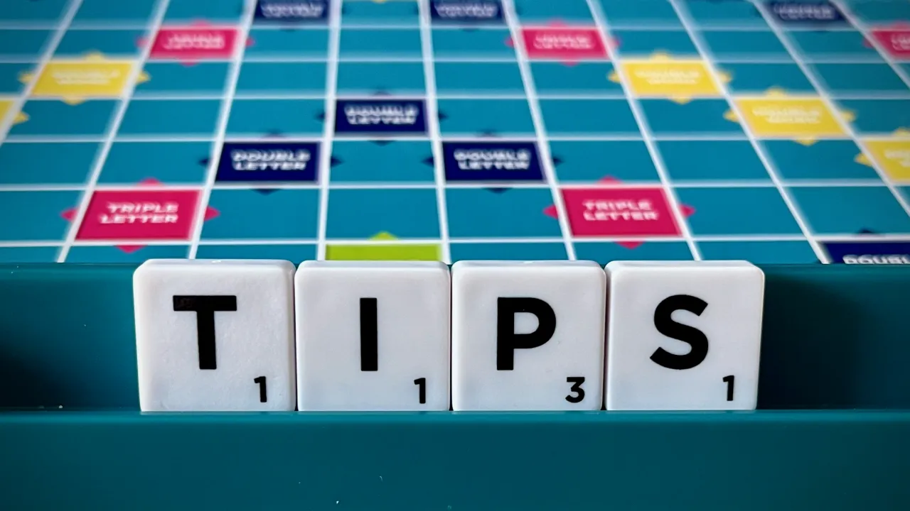The word tips on a Scrabble board